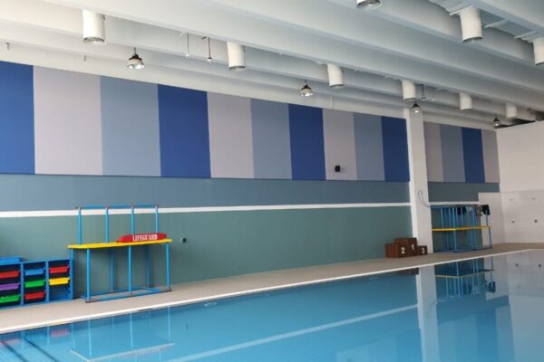Acoustic wall panels installation in Dubai indoor pool for noise reduction