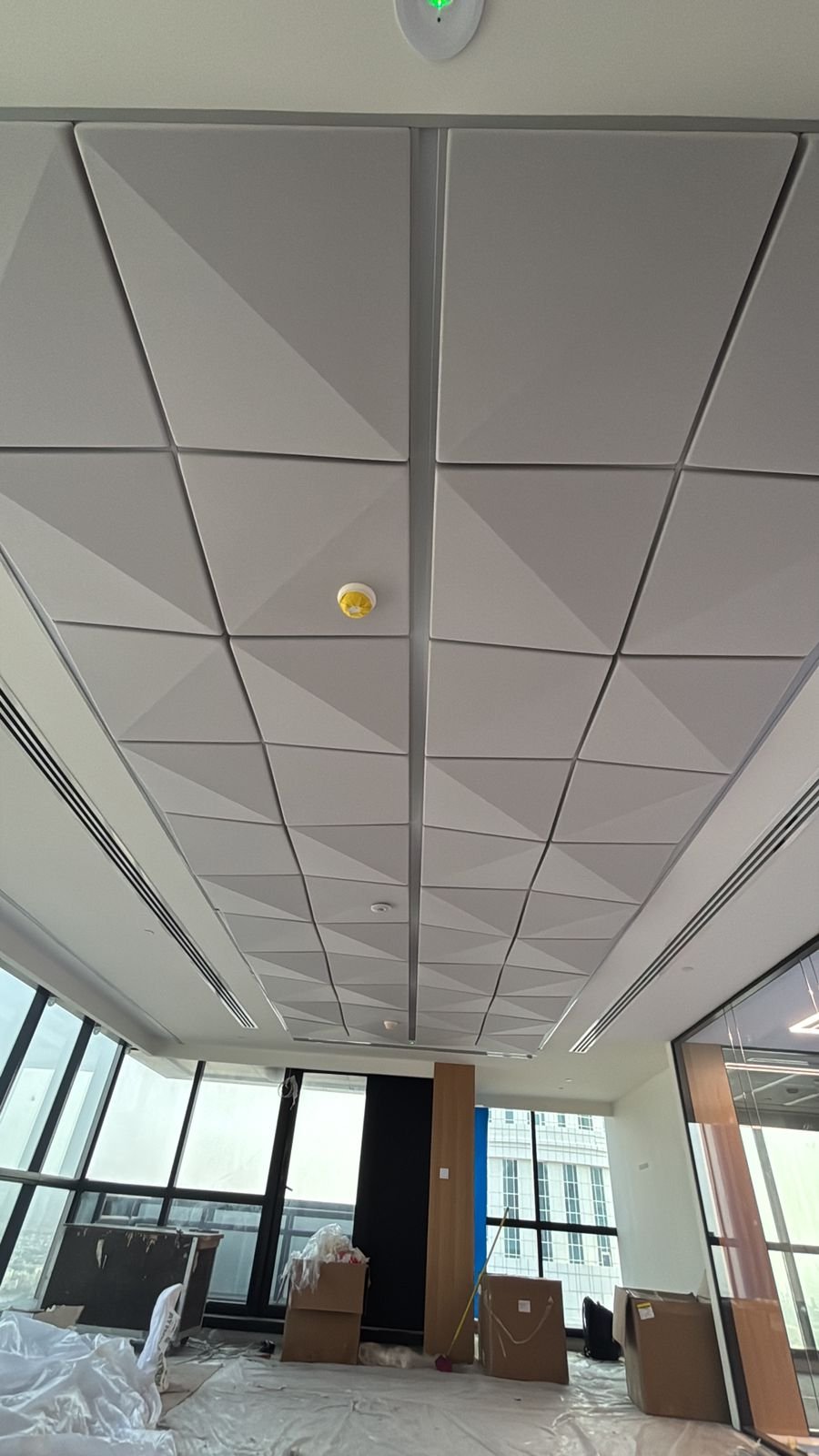 Acoustic insulation ceiling baffle layer and structural integration