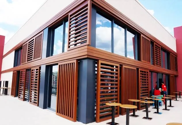Modern building facade with timber aesthetic in the UAE using Technowood architectural solutions